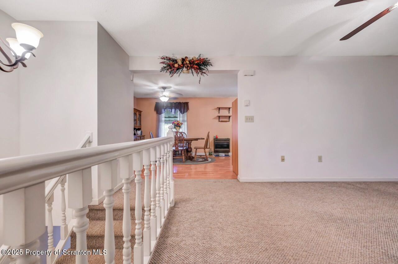 145 Tunnel Road Nicholson, PA 18446 - Photo 12 of 70 a view of a livingroom with a chandelier