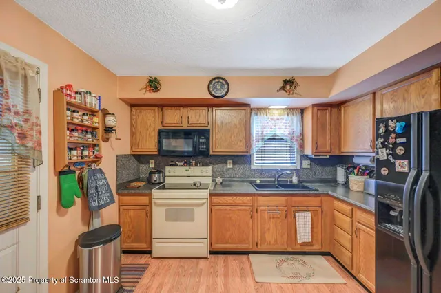 a view of a wooden deck with furniture