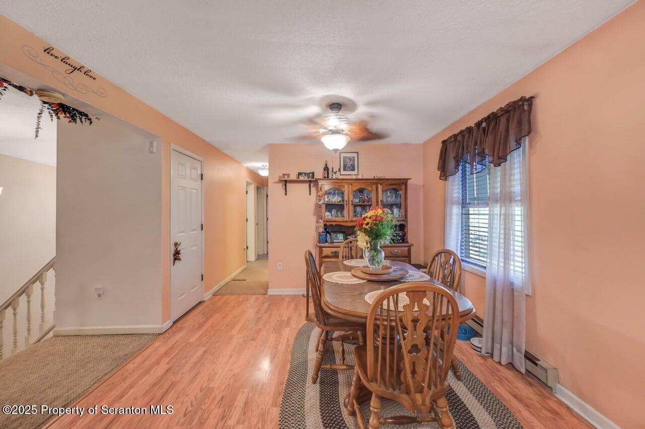 145 Tunnel Road Nicholson, PA 18446 - Photo 23 of 70 a view of a dining room with furniture window and wooden floor