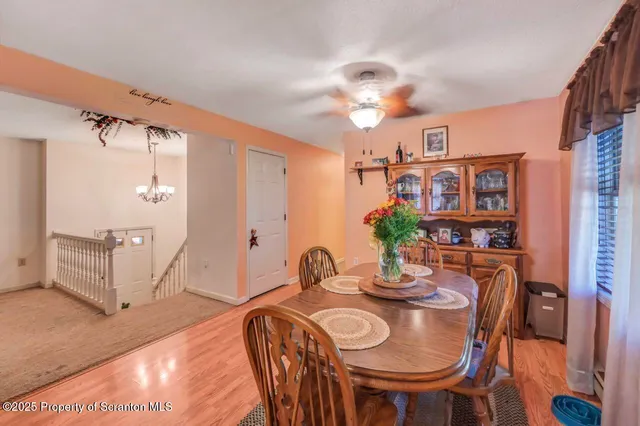 a view of a chair and table in the garden