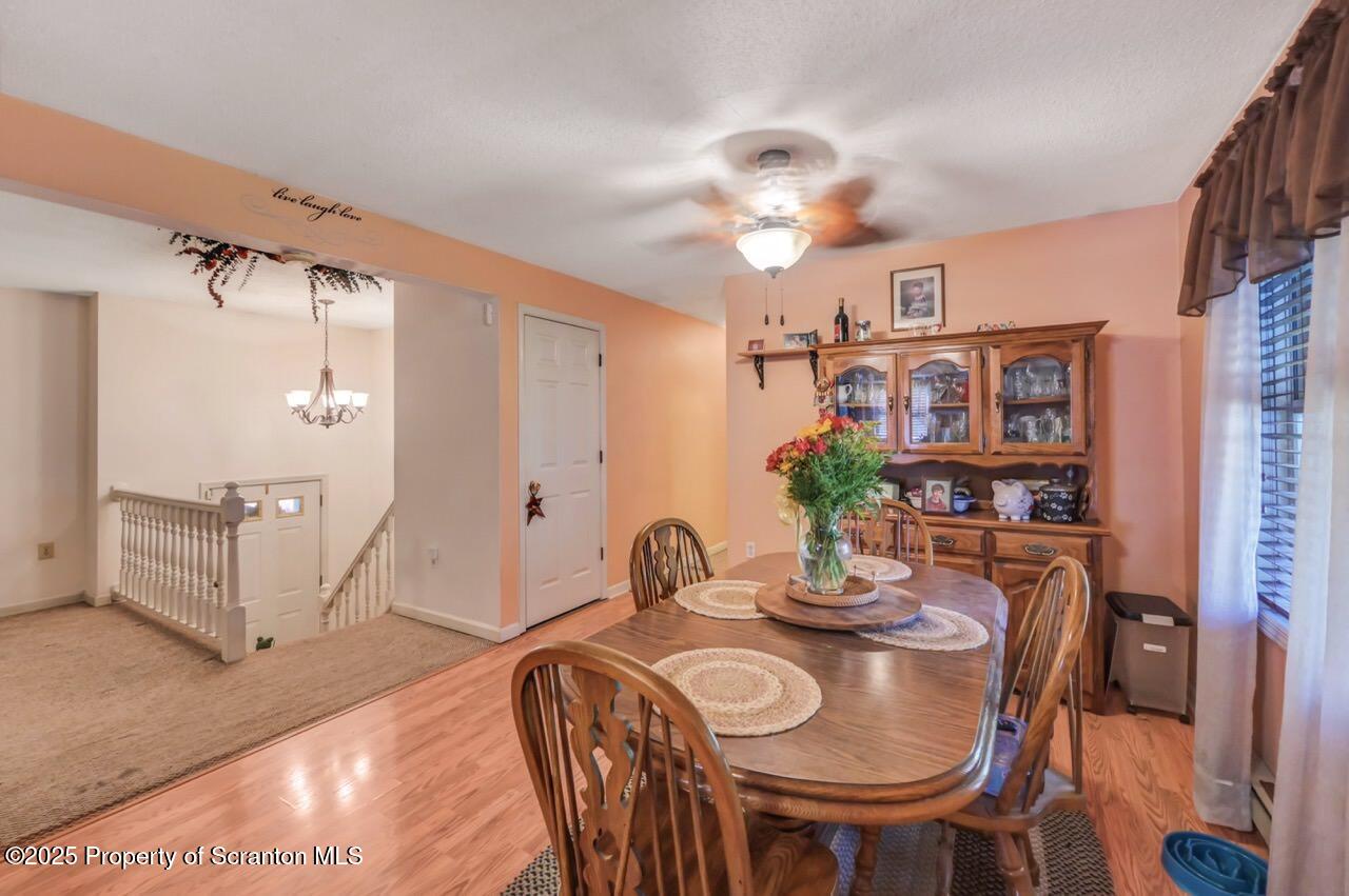145 Tunnel Road Nicholson, PA 18446 - Photo 24 of 70 a dining room with furniture and wooden floor
