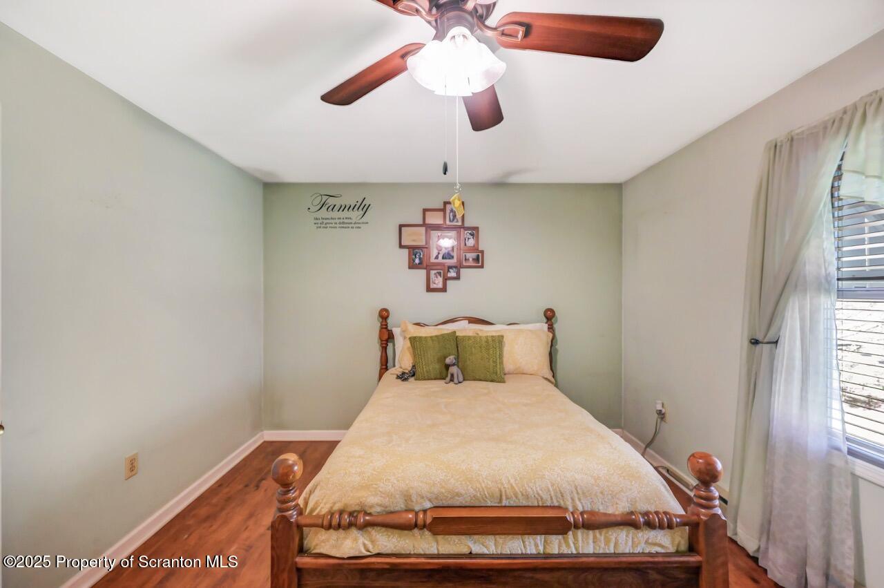 145 Tunnel Road Nicholson, PA 18446 - Photo 29 of 70 a bed room with a bed and a chandelier