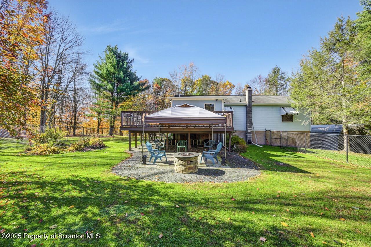 145 Tunnel Road Nicholson, PA 18446 - Photo 3 of 70 a view of a patio with a table and chairs