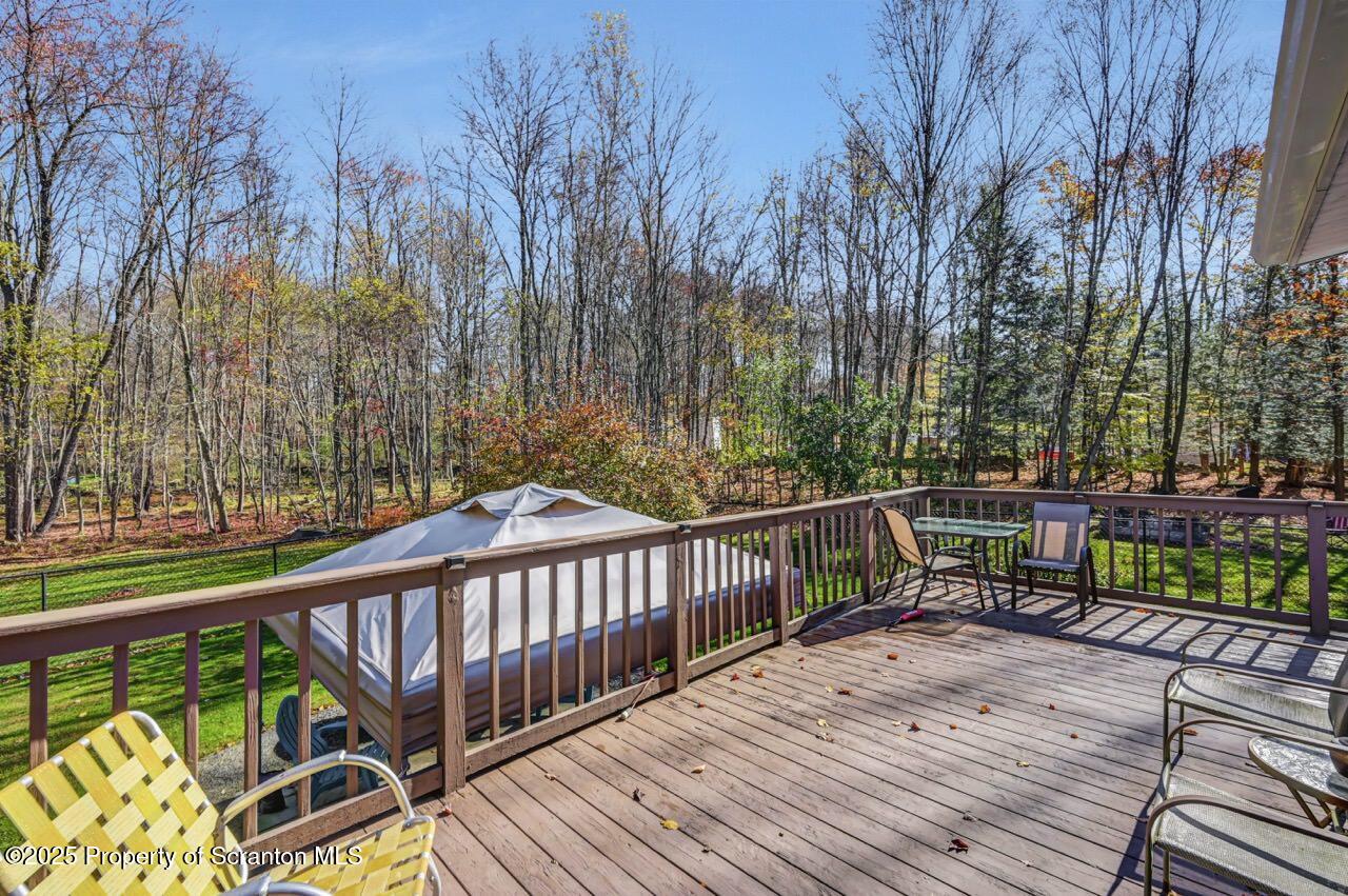145 Tunnel Road Nicholson, PA 18446 - Photo 45 of 70 a view of a wooden deck with furniture