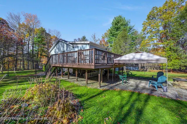 a front view of house with yard and outdoor seating
