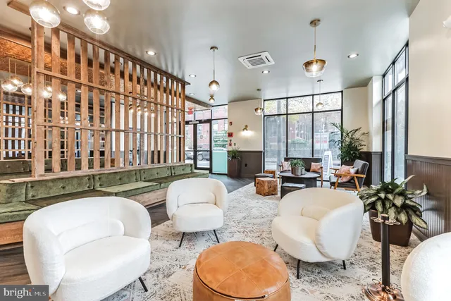 a living room with furniture and a large window