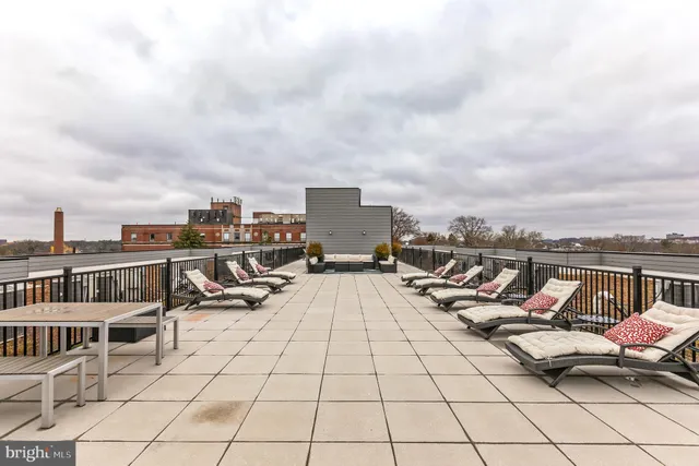 a view of roof deck with seating space