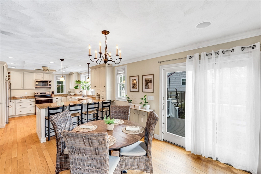54 Old Merrill Street Amesbury, MA 01913 - Photo 8 of 34 a view of a dining room with furniture window and wooden floor