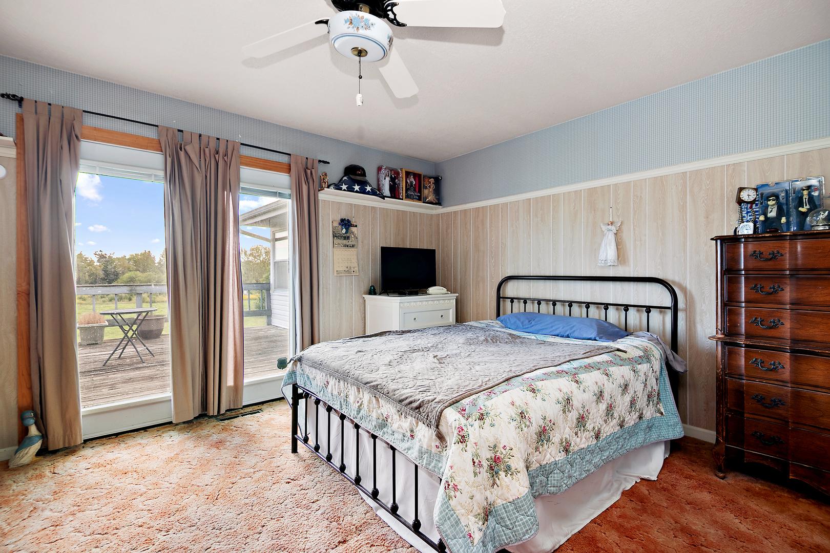 52 Highway 45 Sigel, IL 62462 - Photo 12 of 57 a bedroom with a large bed and a chandelier