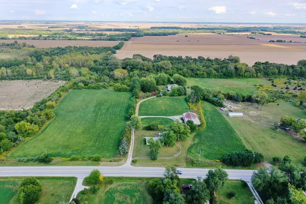an aerial view of a golf course with chairs
