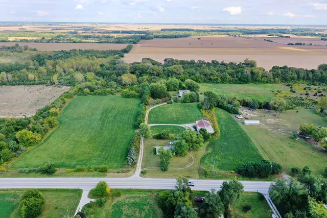 an aerial view of a golf course with chairs