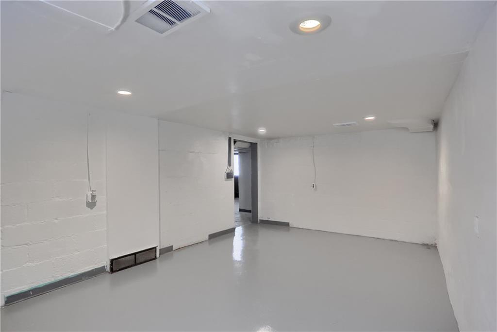 5216 Verona Road Verona, PA 15147 - Photo 25 of 42 an empty room with windows and entrance
