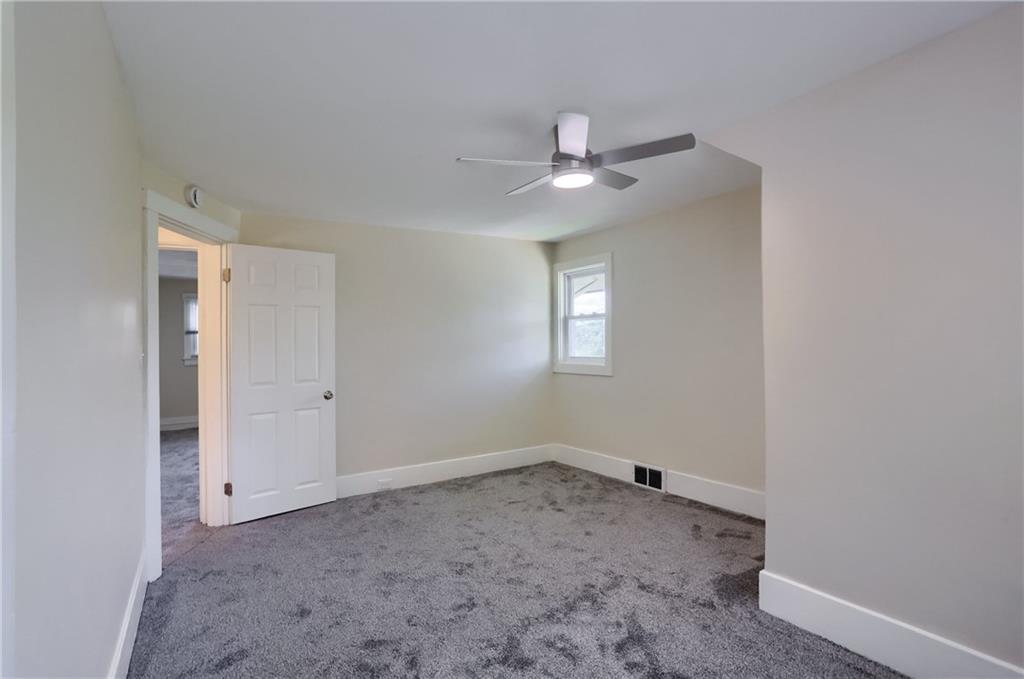 5216 Verona Road Verona, PA 15147 - Photo 40 of 42 a view of a livingroom with a ceiling fan and window