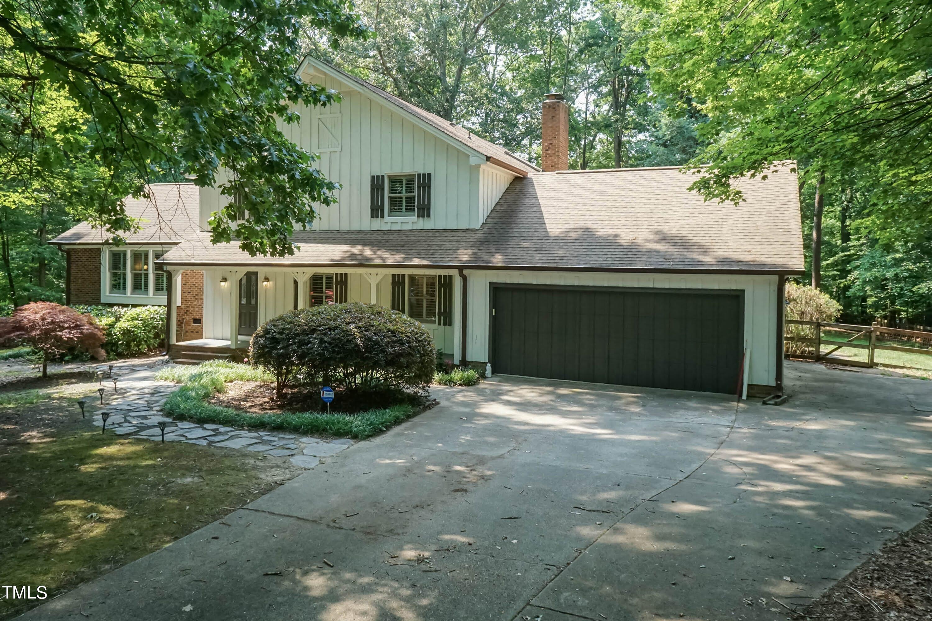 9209 Oneal Road Raleigh, NC 27613 - Photo 1 of 53 a front view of a house with a yard and garage