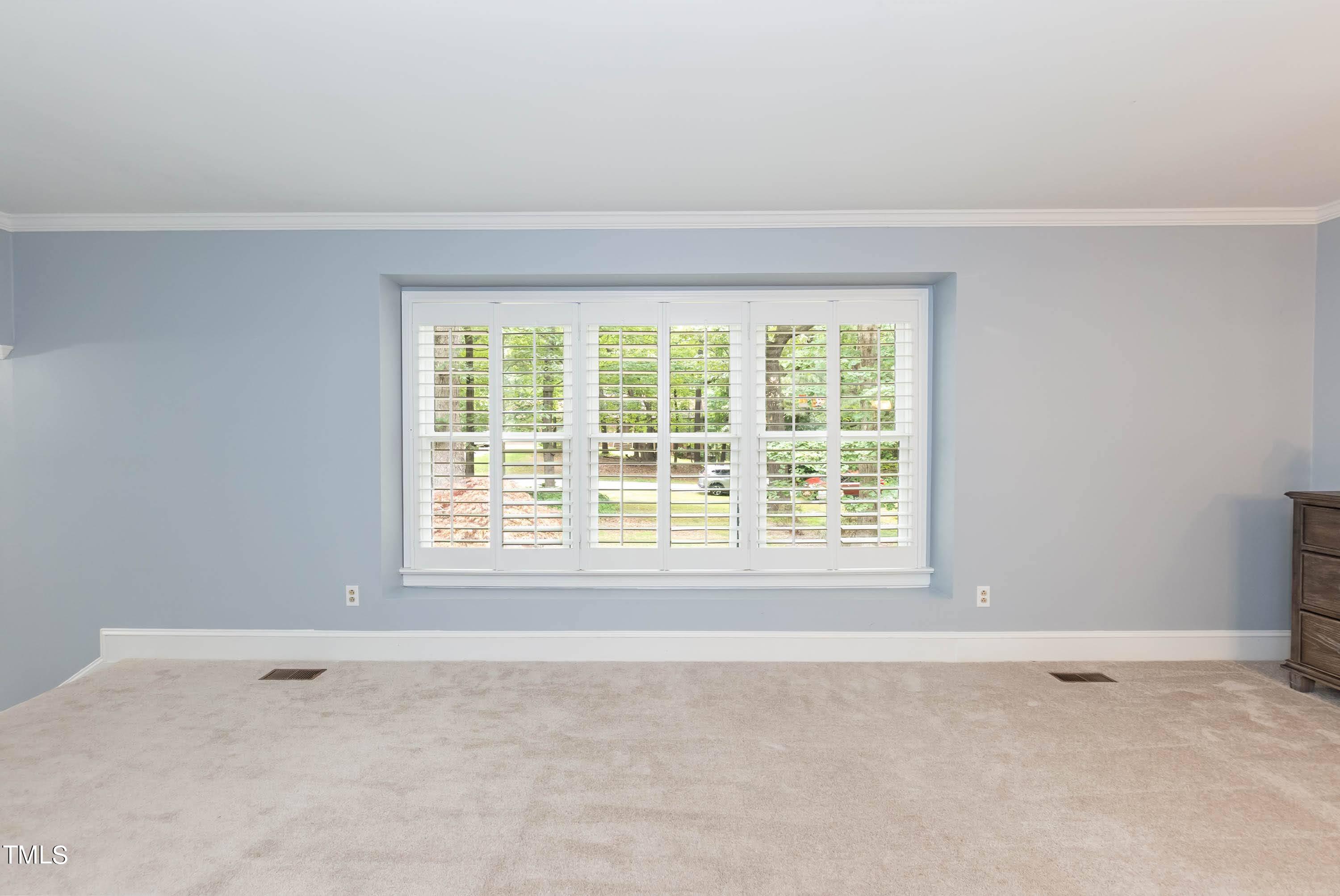9209 Oneal Road Raleigh, NC 27613 - Photo 15 of 53 a view of an empty room with a window