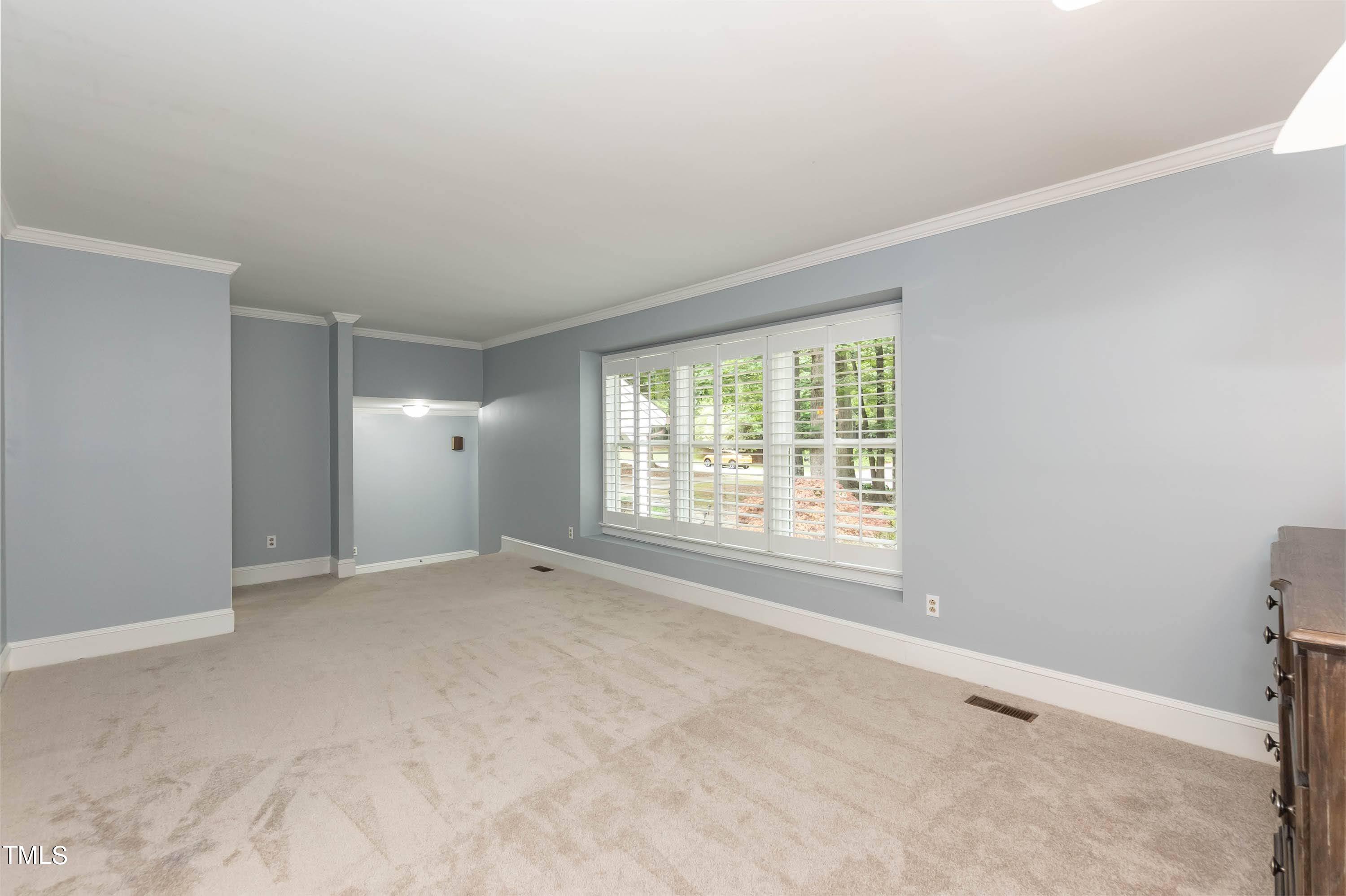 9209 Oneal Road Raleigh, NC 27613 - Photo 16 of 53 an empty room with windows