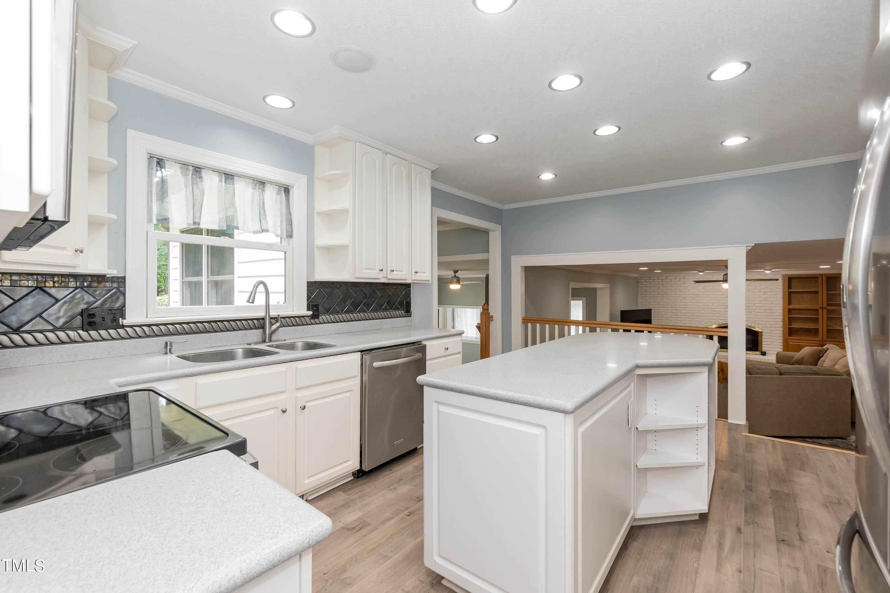 9209 Oneal Road Raleigh, NC 27613 - Photo 17 of 53 a kitchen with a sink stove and refrigerator
