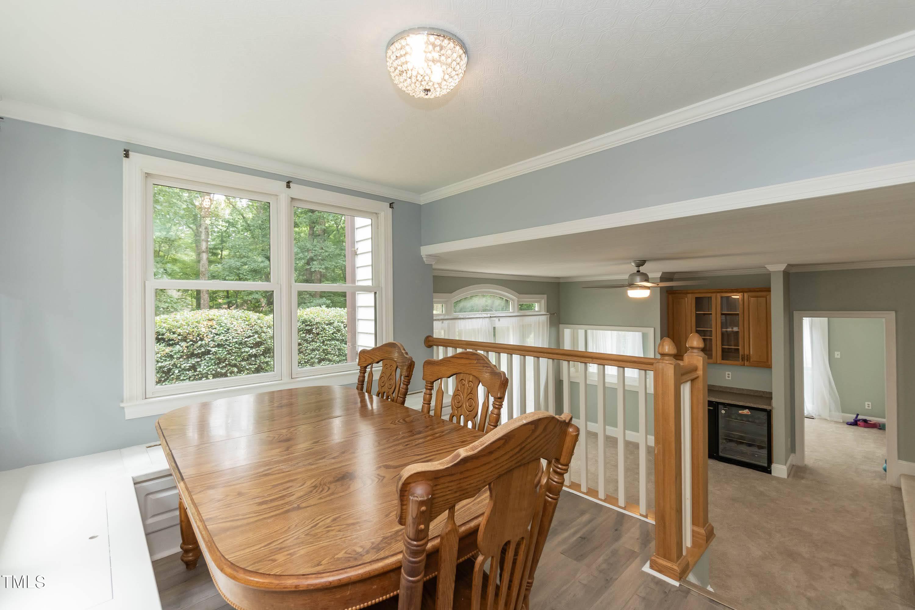 9209 Oneal Road Raleigh, NC 27613 - Photo 22 of 53 a view of a dining room with furniture window and outside view
