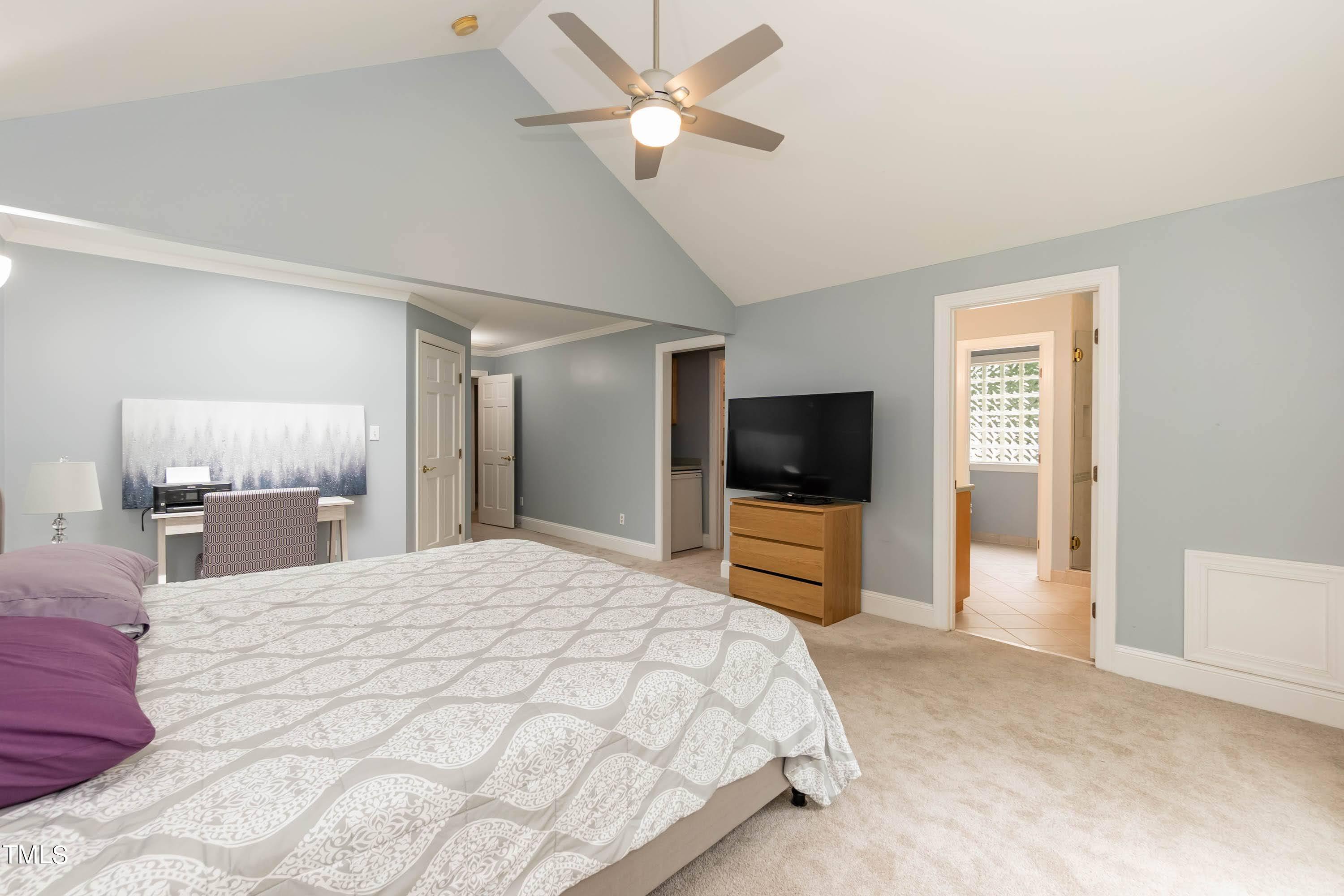 9209 Oneal Road Raleigh, NC 27613 - Photo 29 of 53 a bedroom with a bed and a flat screen tv