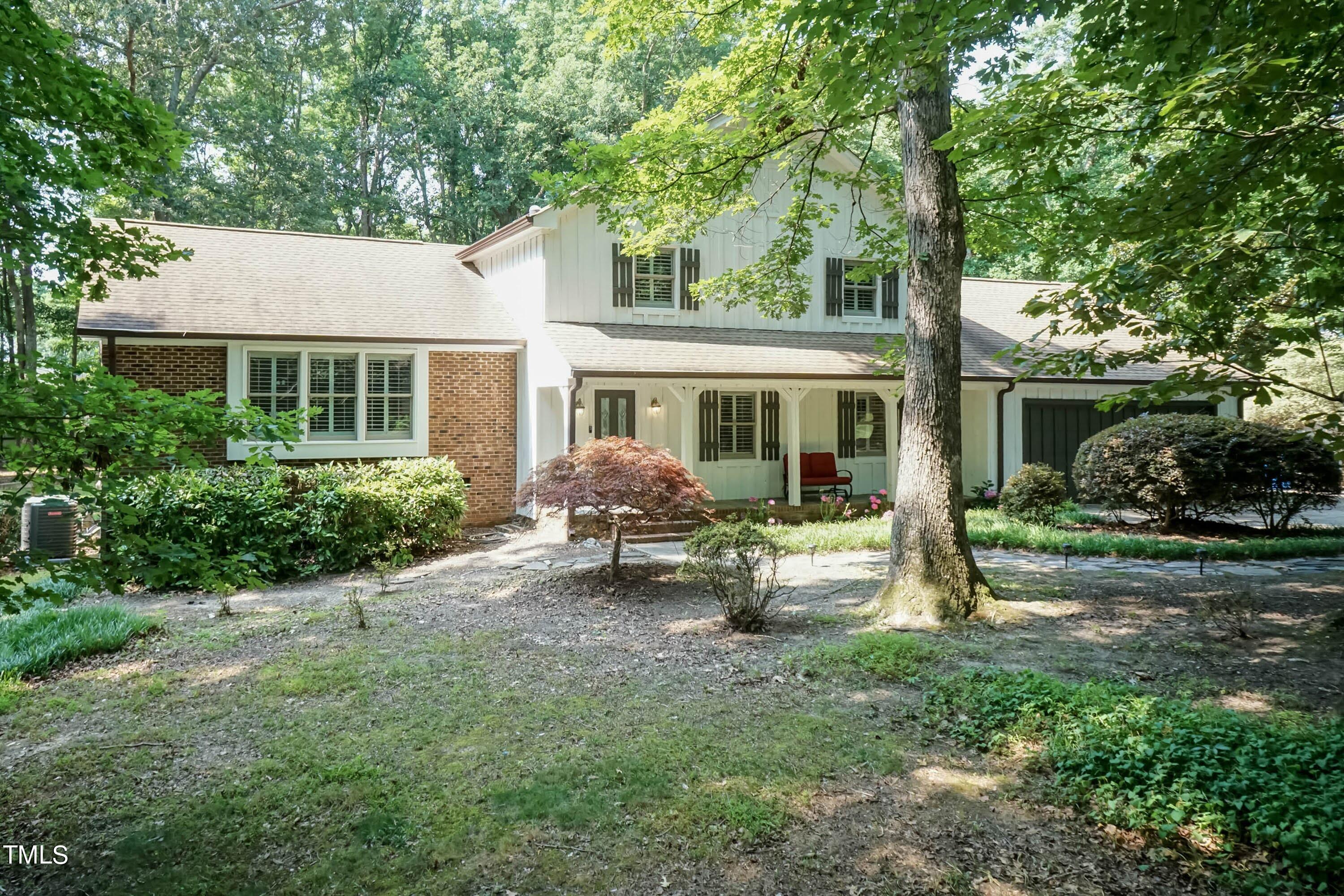 9209 Oneal Road Raleigh, NC 27613 - Photo 3 of 53 a view of a house with backyard sitting area and garden