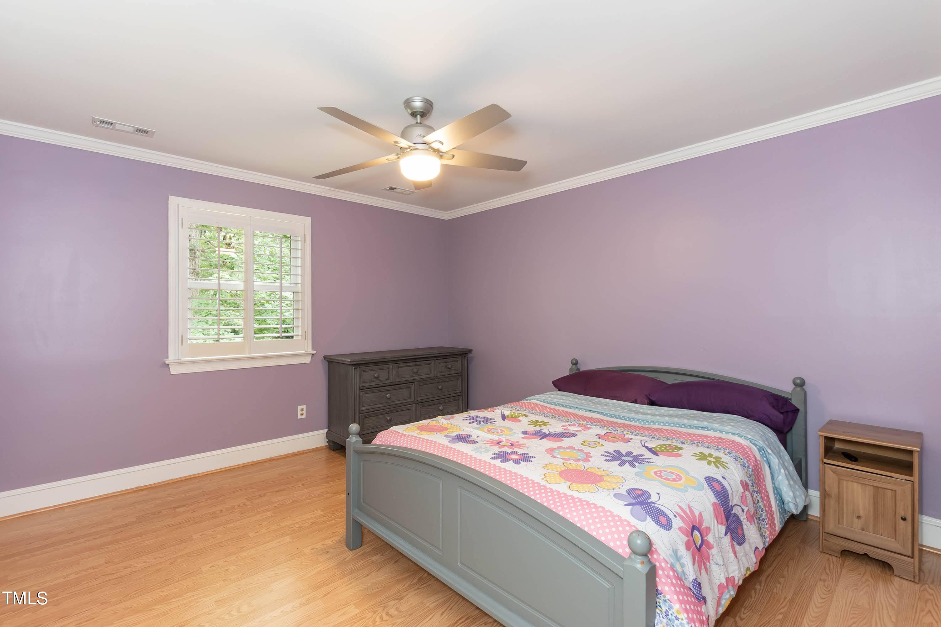 9209 Oneal Road Raleigh, NC 27613 - Photo 38 of 53 a bedroom with a bed and a window