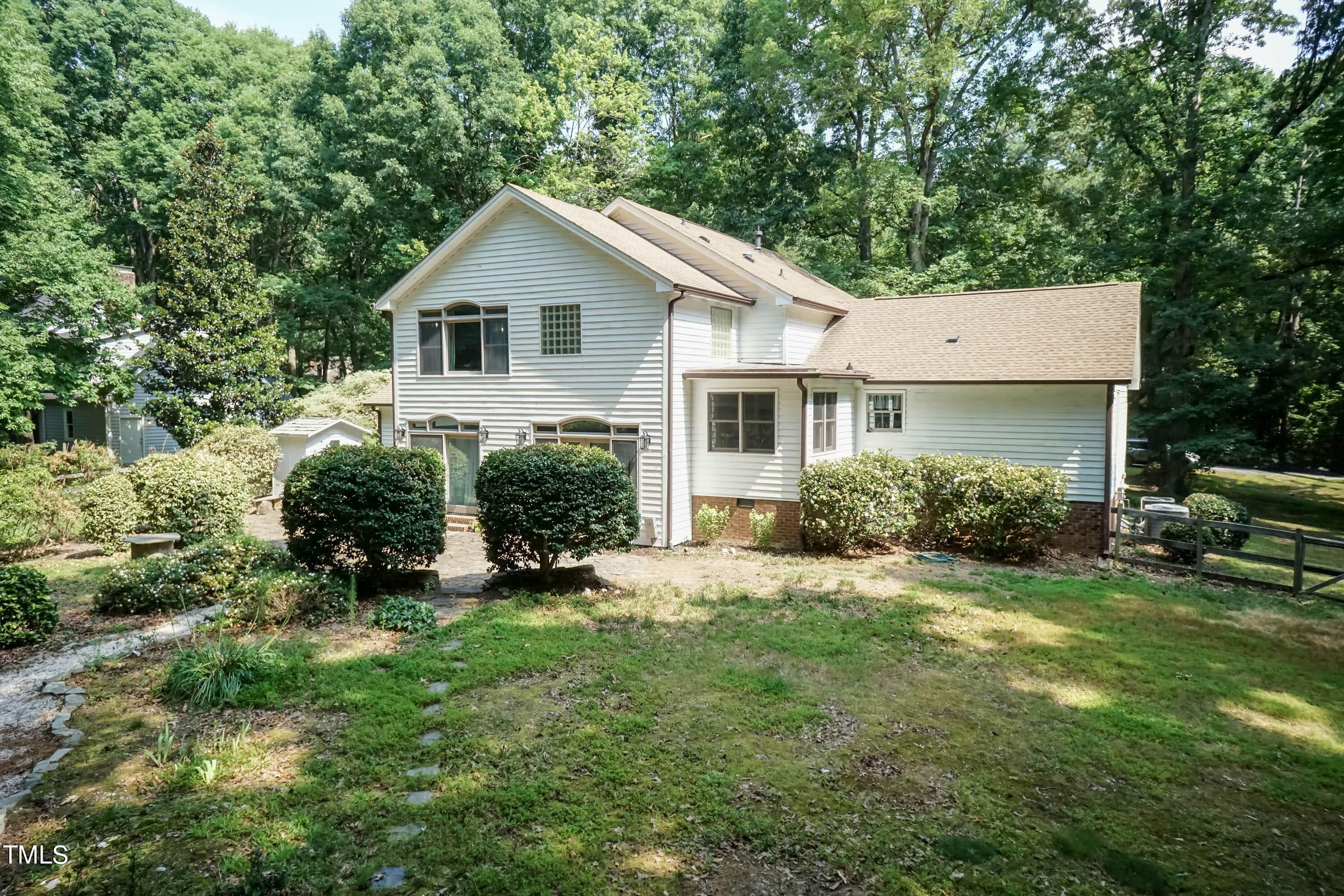 9209 Oneal Road Raleigh, NC 27613 - Photo 47 of 53 a view of a house with a yard and sitting area