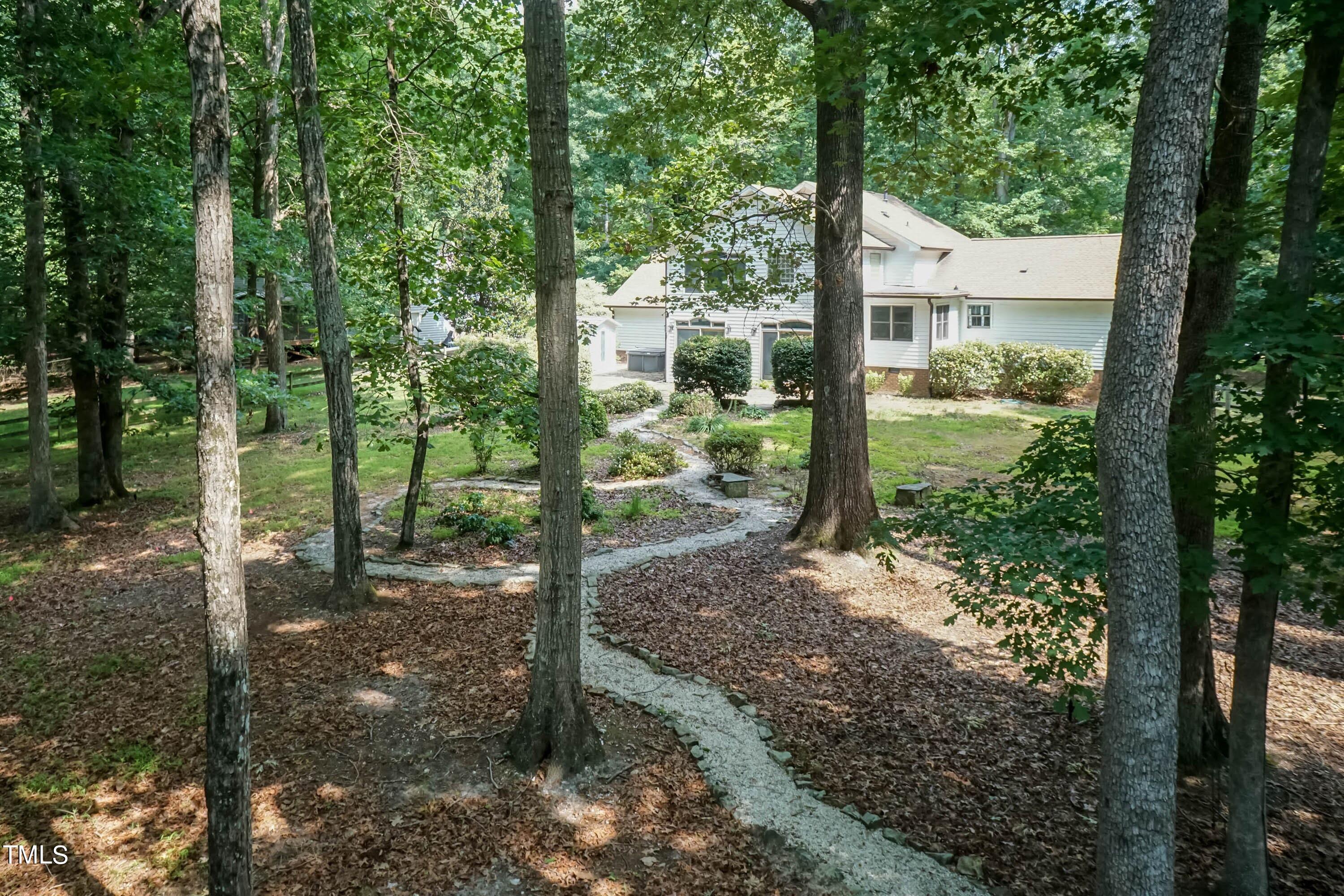 9209 Oneal Road Raleigh, NC 27613 - Photo 48 of 53 a view of a tree in the backyard of a house