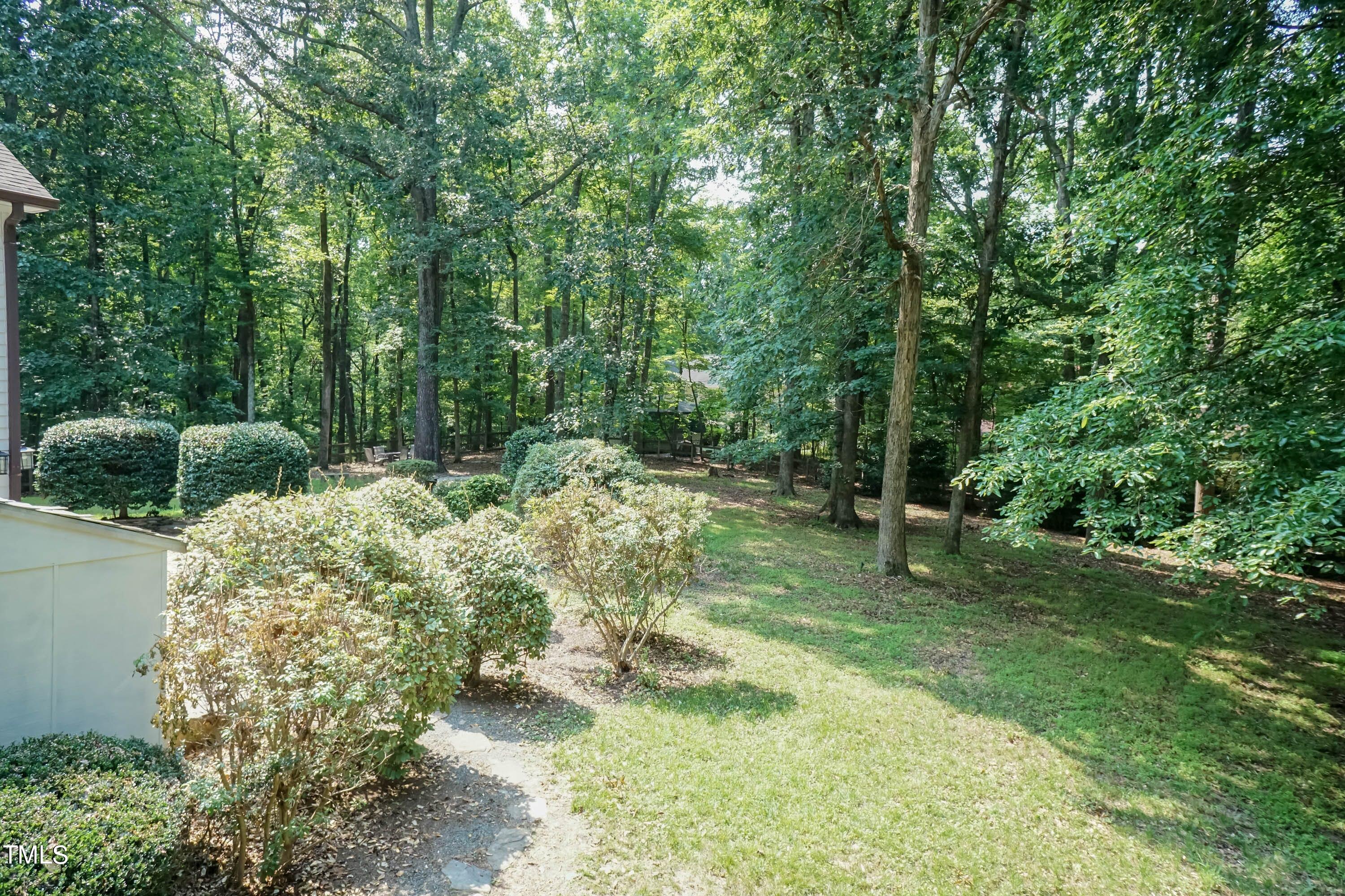 9209 Oneal Road Raleigh, NC 27613 - Photo 51 of 53 a backyard of a house with lots of green space