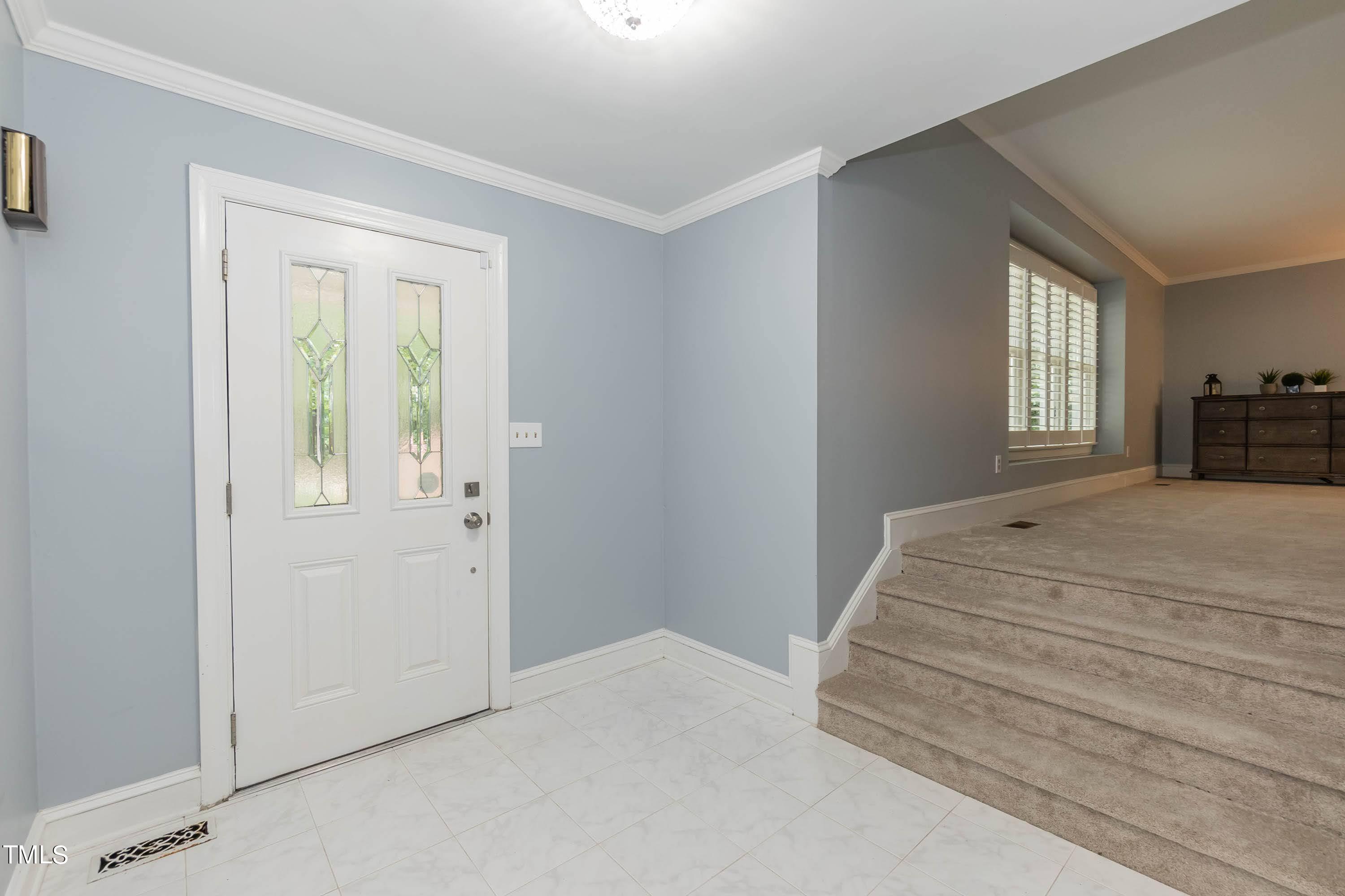 9209 Oneal Road Raleigh, NC 27613 - Photo 9 of 53 a spacious bedroom with a bed and a window
