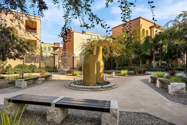 a view of a fountain with the ground in front of it