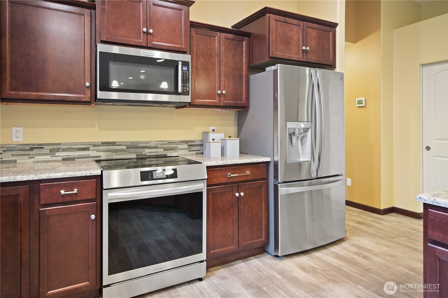 1914 South Discovery Road Port Townsend, WA 98368 - Photo 12 of 39 a kitchen with stainless steel appliances granite countertop a refrigerator stove and microwave