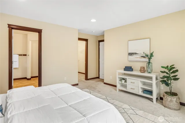 a bedroom with a bed and a cabinets