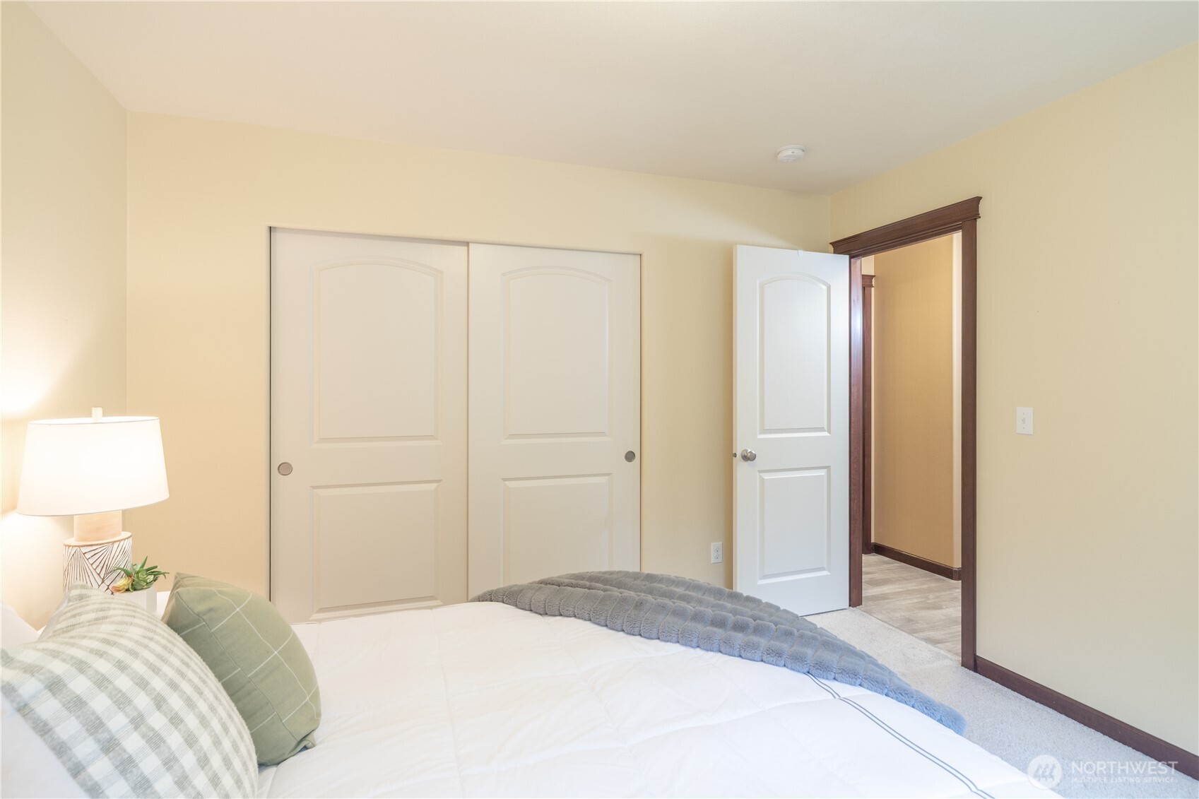 1914 South Discovery Road Port Townsend, WA 98368 - Photo 25 of 39 a bedroom with a bed and a lamp