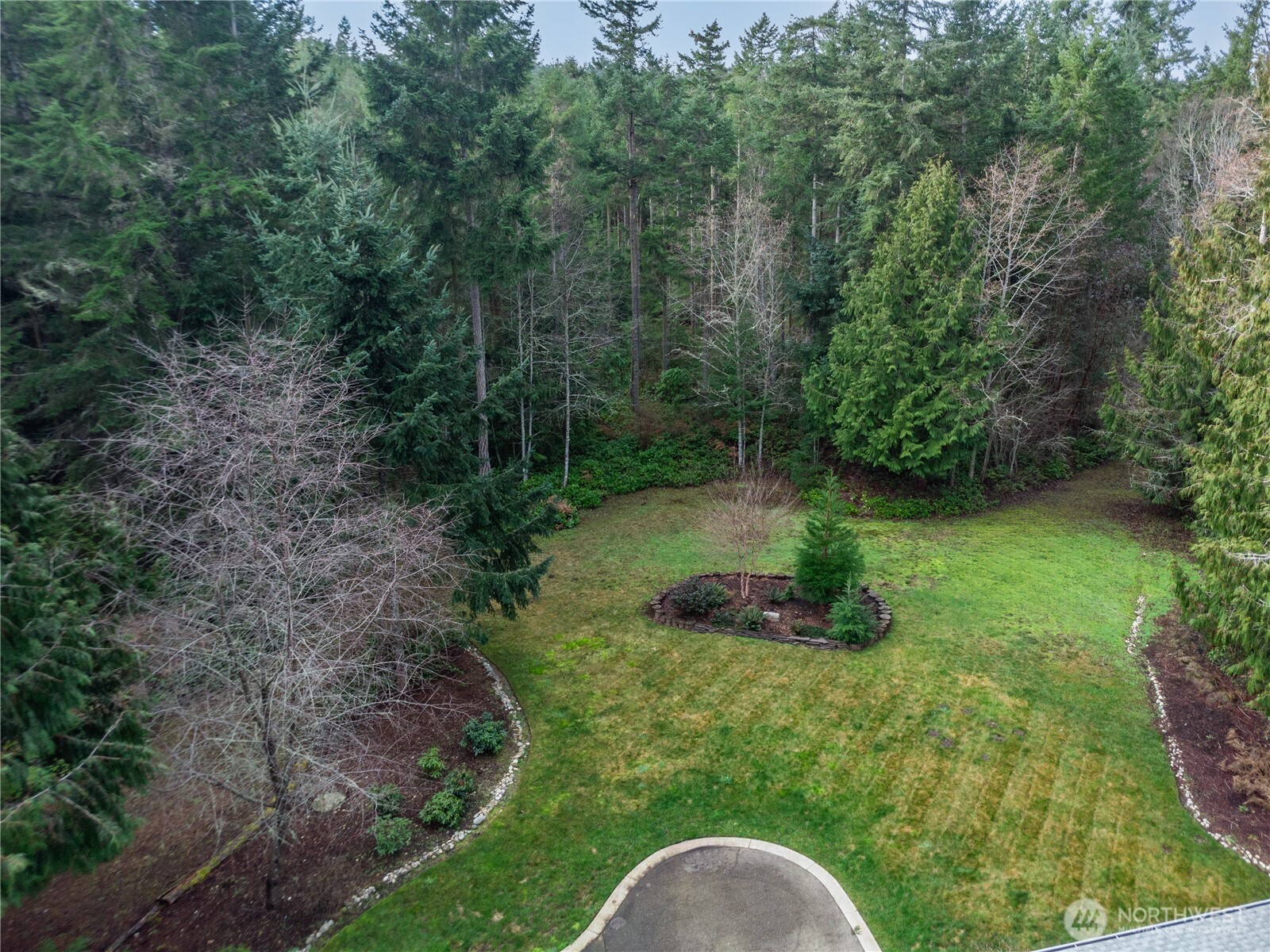 1914 South Discovery Road Port Townsend, WA 98368 - Photo 33 of 39 a backyard of a house with a yard and outdoor seating
