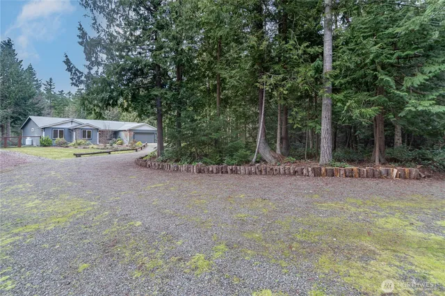 a backyard of a house with lots of green space