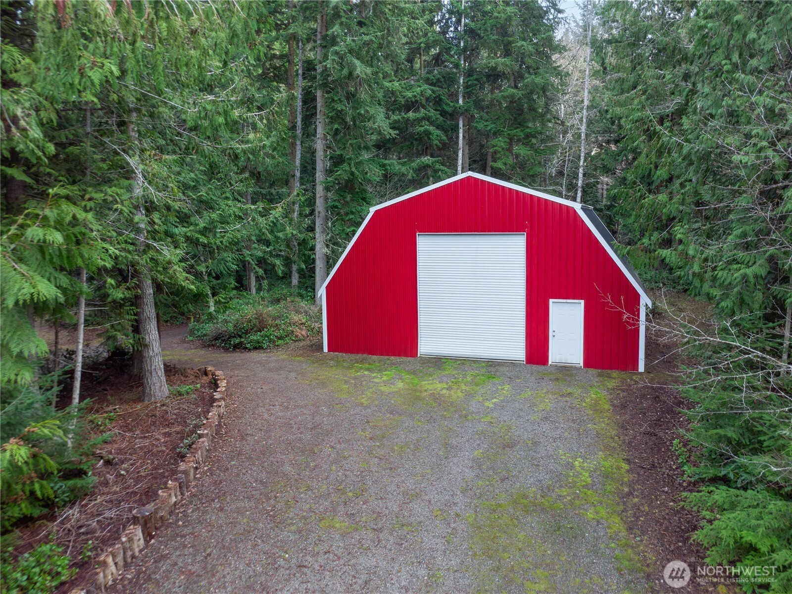 1914 South Discovery Road Port Townsend, WA 98368 - Photo 36 of 39 a view of a wooden fence with a trees in the background