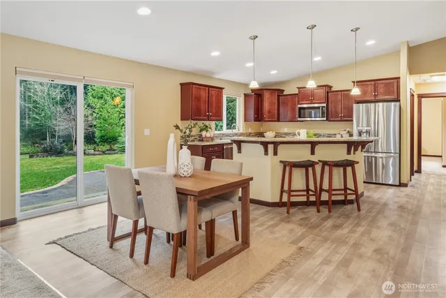 a view of a dining room with furniture window and outside view