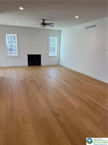 a bathroom with a sink toilet and a mirror