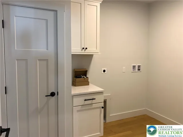 an empty room with a ceiling fan and a window