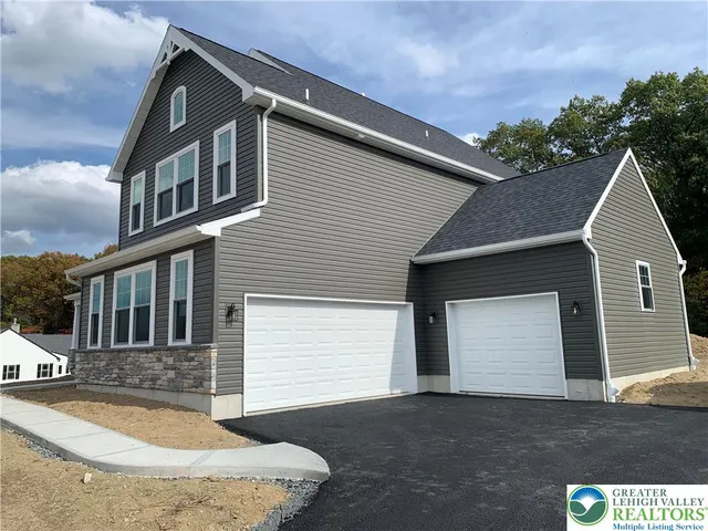 a front view of a house with a garage