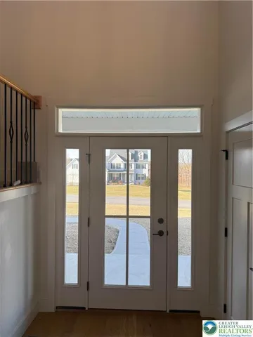 a kitchen with a sink a center island and a window