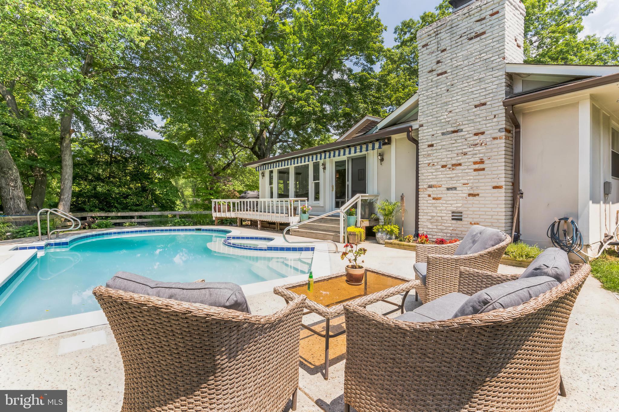 9329 Harvey Road Silver Spring, MD 20910 - Photo 33 of 40 a view of a patio with couches chairs and a wooden floor