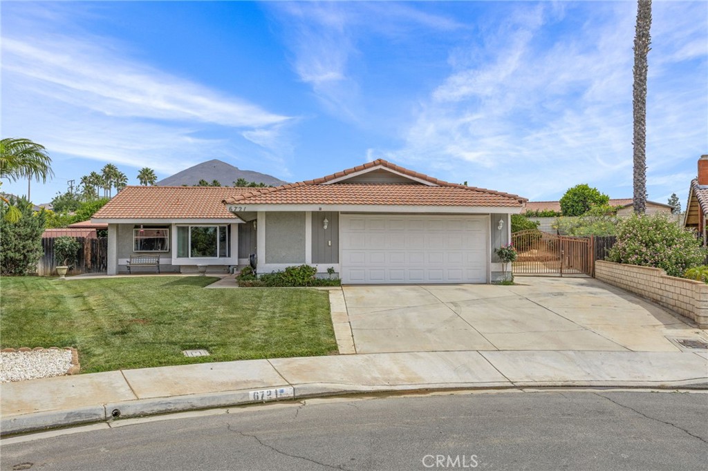 6721 Zuma Place Riverside, CA 92509 - Photo 1 of 1 front view of a house with a garden