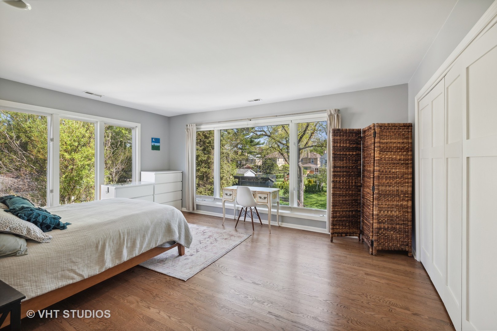 526 Uvedale Road Riverside, IL 60546 - Photo 24 of 34 a bedroom with a bed and large windows