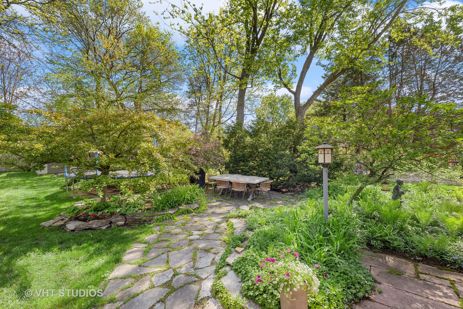 526 Uvedale Road Riverside, IL 60546 - Photo 29 of 34 a view of a garden with lawn chairs