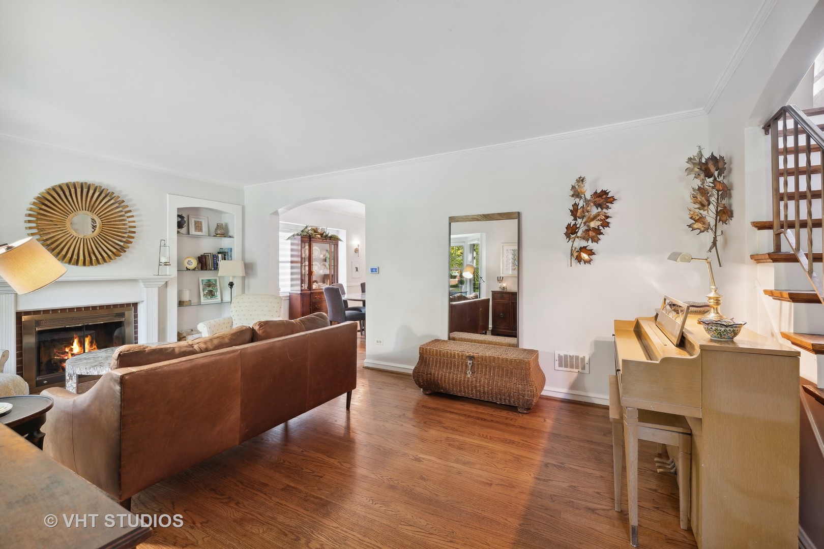 526 Uvedale Road Riverside, IL 60546 - Photo 5 of 34 a living room with furniture a fireplace and a large window