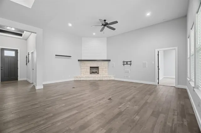 a view of kitchen with wooden floor and electronic appliances