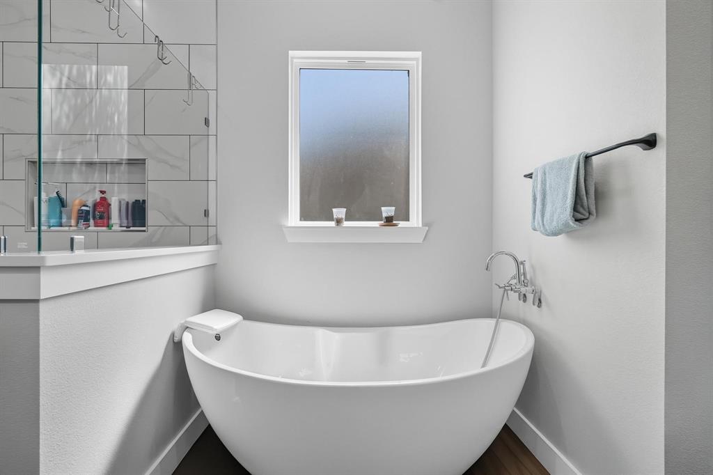 6502 Randy Avenue Abilene, TX 79606 - Photo 17 of 37 a white bath tub sitting next to a white sink and a toilet