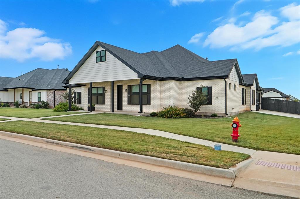 6502 Randy Avenue Abilene, TX 79606 - Photo 2 of 37 a front view of a house with a yard