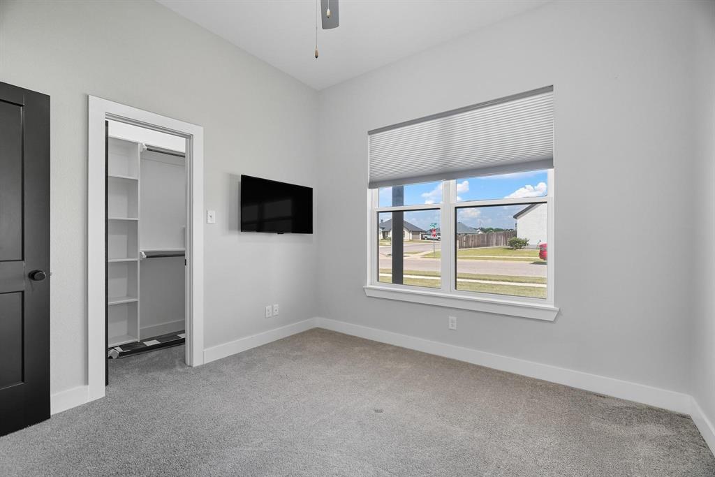 6502 Randy Avenue Abilene, TX 79606 - Photo 24 of 37 a view of an empty room with a window and a kitchen